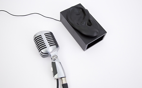 A Shure 55 microphone is connected to a computer’s sound card and instrumented with a custom button.
